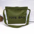 Army green canvas tote bag with adjustable shoulder strap and black printed text - Green