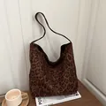 Vintage leopard print tote bag with brown pattern and large capacity for women on table - Leopard Brown