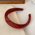 Deep red fabric headband with vintage gold texture and handmade woven label detail - Red Yellow Striped