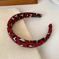 Red leopard print fabric headband featuring a handmade label and vintage pattern - Black White Spotted