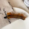Handgefertigte Schildpatt-Haarklammer in Katzenform mit schwarzer Schleife - Karamell Katze Bananen-Clip