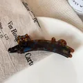 Fermaglio per capelli a gatto in acetato tartarugato con motivi blu e timbro dorato - Clip A Banana Per Gatti Blu E Marroni