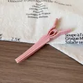 Pink hair root volumizing clip with non-slip texture for high cranial top styling - Pink