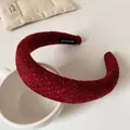 Elegant wine red tweed padded headband with handmade label on white mug base - Red