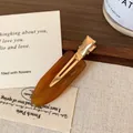 Amber acetate water drop hair clip with French style engraving and gold metal base - Caramel color