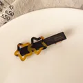 Graziosa clip per capelli a stella con motivo tartarugato ambra e scritta dorata - Fermaglio Stella Tartarugato Chiaro
