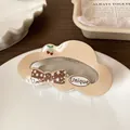 Unique milk tea color cloud hair claw with star pattern bow and cherry detail - Light Coffee Cloud Claw