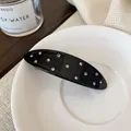 Eleganter schwarzer Acetat-Haarclip mit funkelnden Strasssteinen im modernen Design - Schwarze Ovale Haarspange
