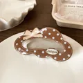 Polka dot chocolate brown hair claw clip with a beige bow and Unique logo detail - Dark Coffee Dots Cloud Claw