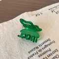 Pince à cheveux en acétate vert foncé translucide avec inscription FRANCE Handmade dorée - Vert