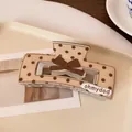 Beige rectangle hair claw clip with dark brown polka dots and a 3D ribbon bow detail - Light Coffee Polka Dot Square