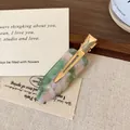 Acetate hair clip with green and pink marble texture and golden metal duckbill clip - Pink Green Floral