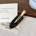 French vintage black acetate alligator hair clip with gold metal finish on wood tray - Black