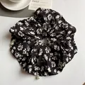 Floral print oversized scrunchie in black and white with elegant pearl decorations - Black Floral Knit Scrunchie