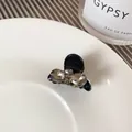 Kleiner schwarzer Haarklammer mit Champagner-Strass-Schleife für elegantes Haarstyling - Schwarz