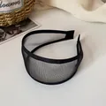 Cerchietto largo in rete nera dal design minimalista con texture velata e bordi rifiniti - Nero