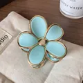 Light blue flower hair claw clip with gold metal edges for elegant hairstyling - Sky Blue Flower Claw