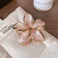 Pink resin plumeria flower hair claw clip with elegant gold metal frame for women - Light Pink