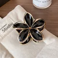 Elegant black and gold enamel frangipani hair claw clip with large five-petal flower - Black