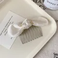 Elegant cream white silk bow hair comb with silver metal teeth for vintage styling - Beige Bow Hair Comb