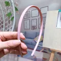 Minimalist pink thin headband with non-slip teeth for secure hair styling - Pink