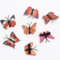 Set of colorful butterfly hair clips with diverse realistic patterns on white background - Red Series