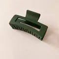 Matte dark green hollow rectangular hair claw clip for women on pink background - Dark Green