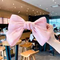Elegant large pink satin bow hair clip with pearlescent finish for women and girls - Pink