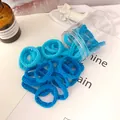 Elastic seamless hair ties in sky blue and navy blue sets stored in a clear jar - Blue Series Wave