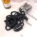Black seamless elastic hair ties with a clear storage jar for women's hair styling - Black Wave Style