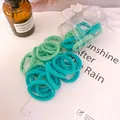 Mint and teal seamless elastic hair ties with wave texture and storage jar - Green Wave Style