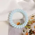 Pastel blue spiral telephone wire hair tie with a matte finish for daily hair styling - Sky Blue