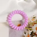 Pink purple spiral telephone wire hair tie with a matte finish for a seamless look - Light Purple