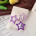 Three-piece star-shaped hair clips in gradient purple tones on a decorative card - Five-pointed Star