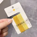 Set of 10 yellow gradient elastic hair bands on a Vogue Girl display card - Yellow Series