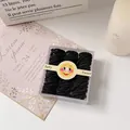 Gomas de pelo negras para niños en caja transparente con etiqueta de cara sonriente - Bambú Negro