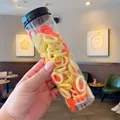 Jar of high-elasticity candy colored hair ties for girls in yellow and orange tones - Yellow