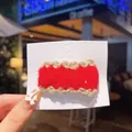Handmade red crochet bow hair clip with cream scalloped edges on fashion display card - Wine Red Lace