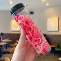 Pink and red elastic hair ties for girls in a clear cylinder container with black lid - Rose Red