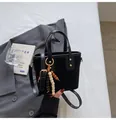 Black suede and leather bucket bag with quilted stitching and beaded tassel charm - With Beaded Pendant / Black