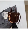 Dark brown suede bucket bag with quilted patterns and ethnic beaded charm pendant - With Beaded Pendant / Brown