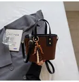 Brown vintage quilted bucket bag with black handle and wooden bead tassel decoration - With Beaded Pendant / Brown