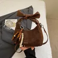 Brown vintage matte PU shoulder bag with decorative leather bow and beaded tassel charm - With Pendant / Brown