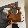 Brown frosted PU leather crossbody bag with oversized bow handle and wooden beads - With Pendant / Brown