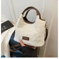White plush bucket bag with brown leather trim and adjustable shoulder strap - With Pendant Style / White