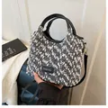 Tweed bucket bag for women with black leather trim and gold hardware in black and white - With Pendant Style / Black