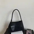 Minimalist black matte shoulder bag with sleek handle and decorative matching pendant - With Small Pouch / Black