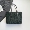 Quilted tote bag with green camouflage print and gold rivet details for work - Black