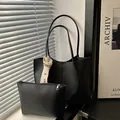 Black large leather tote bag with matching pouch and fashion strap for women's daily commute - Tote with Handbag (ZZ3292) / Black