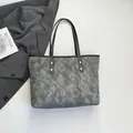 Grey quilted tote bag with cloud patterns and black leather straps for daily commute - Gray